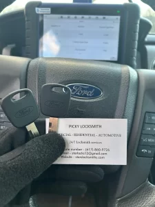 Ford car keys duplicated and programmed by Picky Locksmith using diagnostic tool.