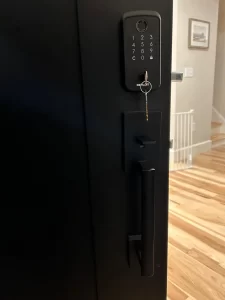 Residential smart lock with keypad installed on front door.